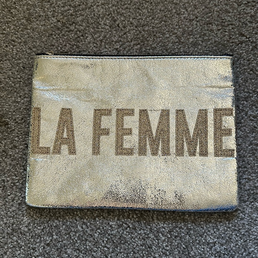 Silver pouch, ideal for beauty products and more. Never used